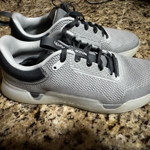 Gray and Black While on Earth training shoes
